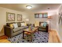 Finished basement with hardwood floors and comfy couches at 1342 Milwaukee St # 5, Denver, CO 80206