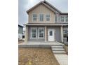 New construction home featuring two-story facade, modern windows, concrete porch, and neutral color palette at 6562 Arbor Blvd # 5, Thornton, CO 80602