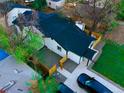 Enjoy the bird's-eye view of this home with its pristine roof, fenced yard, and ample parking at 1450 Syracuse St, Denver, CO 80220