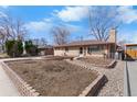 Charming ranch-style home featuring a brick exterior and a well-maintained front yard at 4713 Cody St, Wheat Ridge, CO 80033