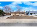 Charming ranch-style home featuring a brick exterior and a well-maintained front yard at 4713 Cody St, Wheat Ridge, CO 80033