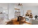 Open-concept living room offering lots of natural light, hardwood floors and an elegant decor at 762 S Paddock St, Elizabeth, CO 80107