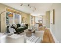 Inviting living room featuring modern decor, plush seating, large windows and hardwood floors at 2255 18Th St, Boulder, CO 80302
