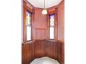 Unique entryway featuring stained glass windows, wood paneling, vintage wallpaper, and a period-appropriate light fixture at 2914 W 29Th Ave, Denver, CO 80211