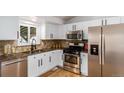 Modern kitchen with stainless steel appliances and granite countertops at 11082 Callaway Rd, Parker, CO 80138