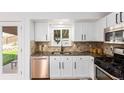 Updated kitchen with granite countertops and stainless steel dishwasher at 11082 Callaway Rd, Parker, CO 80138