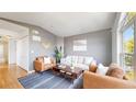 Inviting living room with hardwood floors, cozy seating, and ample natural light at 1670 S Deframe St # C2, Lakewood, CO 80228