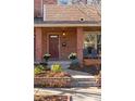 Charming front porch with brick accents and a well-maintained garden at 4511 Perry St, Denver, CO 80212