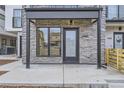Townhouse entryway with stone facade and modern door at 1462 Yates St, Denver, CO 80204