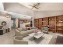 An open floor plan integrates the living room with a kitchen, enhancing flow and connectivity at 7501 S Ivanhoe Cir, Centennial, CO 80112