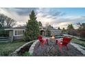Inviting backyard space with fire pit area and comfortable seating, perfect for relaxation at 5631 Silver Bluff Ct, Parker, CO 80134