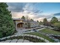 Charming home with lush landscaping, stone accents, and a welcoming walkway at 5631 Silver Bluff Ct, Parker, CO 80134