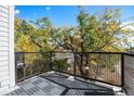 Private balcony with composite decking and metal railing at 1418 Pierce St, Lakewood, CO 80214