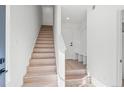Bright entryway with stairs and built-in bench at 1418 Pierce St, Lakewood, CO 80214