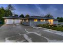 Charming single-story home with gray siding, a detached garage and well-maintained front yard at 1100 E Harvey St, Castle Rock, CO 80108