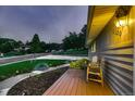 Landscaped front yard with a well maintained lawn and decorative pathway lighting at 1100 E Harvey St, Castle Rock, CO 80108