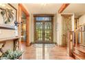 Bright entryway with hardwood floors and French doors at 1138 County Road 65, Evergreen, CO 80439