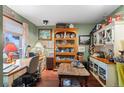Functional home office area featuring a built-in cabinet and plenty of natural light at 29857 Park Village Dr, Evergreen, CO 80439