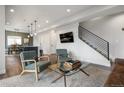 Open-concept living room showcasing modern decor, a comfortable seating area, and seamless flow into the dining space at 4184 Kalamath St, Denver, CO 80211