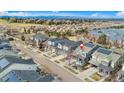 Bird's eye view of a neighborhood featuring a two-story home with solar panels on the roof at 9099 Prairie Sky Ln, Lone Tree, CO 80124