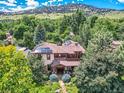 Stunning aerial view of the house with solar panels and lush greenery at 3135 11Th St, Boulder, CO 80304