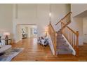 Elegant staircase with wood railing and hardwood floors at 13471 Cascade St, Broomfield, CO 80020