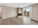 Bright living room with fireplace and access to balcony at 10001 E Evans Ave # D, Aurora, CO 80247