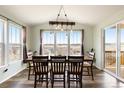 Open dining room with large windows offers plenty of natural light and backyard views at 5998 Berry Ridge Way, Castle Rock, CO 80104