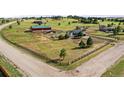 Large property with well-maintained fencing, barn, secondary building and modern farmhouse at 2190 Helen Ct, Parker, CO 80138