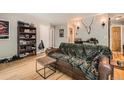 Comfortable living room offers a cozy seating area, shelving, and bright natural light at 6213 Willow Ln, Boulder, CO 80301