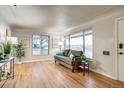 Inviting living room with hardwood floors, natural light, and stylish decor at 3690 N Hudson St, Denver, CO 80207