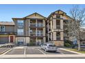 Condo building showcasing stucco and stone finishes, private balconies and reserved parking at 7433 S Quail Cir # 1924, Littleton, CO 80127