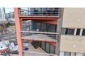 View of condo balconies showing seating and design on a multi-story brick building at 100 Park W Ave # 1806, Denver, CO 80205