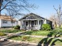 Quaint home with a tidy lawn, showcasing its classic design and curb appeal at 3855 N Cook St, Denver, CO 80205