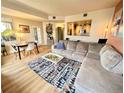 Bright living room and dining area with wood floors and an open layout to the kitchen at 300 W 11Th Ave # 10D, Denver, CO 80204