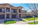 Charming home with a stone facade, a private balcony, and a well-kept lawn at 11374 Xavier Dr # 202, Westminster, CO 80031