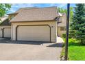 Attached two-car garage and driveway of house at 10262 at 10369 E Red Mtn, Littleton, CO 80127