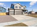 Charming two-story home featuring a spacious driveway and a partially landscaped front yard at 4107 Marble Dr, Mead, CO 80504