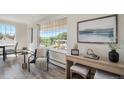 Bright seating area with large windows and a view of the outdoors, perfect for relaxation at 2724 S Ames Way, Denver, CO 80227