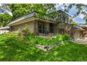 Charming two-story home with landscaped yard and inviting front porch at 7238 W Cedar Cir, Lakewood, CO 80226