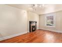 Bright living room with hardwood floors and decorative fireplace creating a cozy ambiance at 723 31St St, Denver, CO 80205