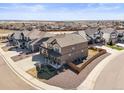 Beautiful two-story home featuring meticulous landscaping, a welcoming front porch, and a well-maintained yard at 1624 Pinion Wing Cir, Castle Rock, CO 80108