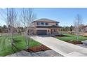 Beautiful two-story home with a spacious driveway and landscaped front yard at 12701 Strawberry Cir, Longmont, CO 80503