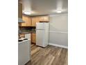 Well-lit kitchen features efficient appliances, ample counter space, and durable flooring at 1390 Emerson St # 107, Denver, CO 80218