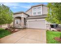 Charming two-story home features a stone accent porch and a spacious two-car garage at 11788 Mill Valley St, Parker, CO 80138