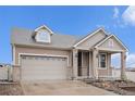 Charming home featuring stone accents, manicured landscaping, and an attached two-car garage at 5521 Ensenada St, Denver, CO 80249