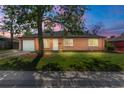 Well-kept single-story brick house showing lush lawn, mature tree, attached garage, and inviting curb appeal at 1269 N Revere St, Aurora, CO 80011