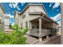 Lovely backyard porch perfect for entertaining and relaxing outdoors at 9723 Bennett Peak St, Littleton, CO 80125