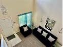 Bright open living space with high ceilings, neutral tones, and plenty of natural light at 19102 E Hampden Dr, Aurora, CO 80013