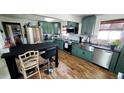 Updated kitchen featuring stainless steel appliances, stylish countertops, and ample storage at 7620 Hooker St, Westminster, CO 80030
